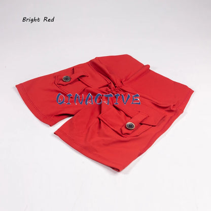 Pantalones Cortos de Yoga QINACTIVE para Mujer con Bolsillos, Fruncidos en los Glúteos, Mallas de Gimnasio de Cintura Alta con Efecto Push Up, Pantalones Cortos Deportivos Sexy para Glúteos, Fitness